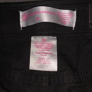 Black skinny button fly jeans